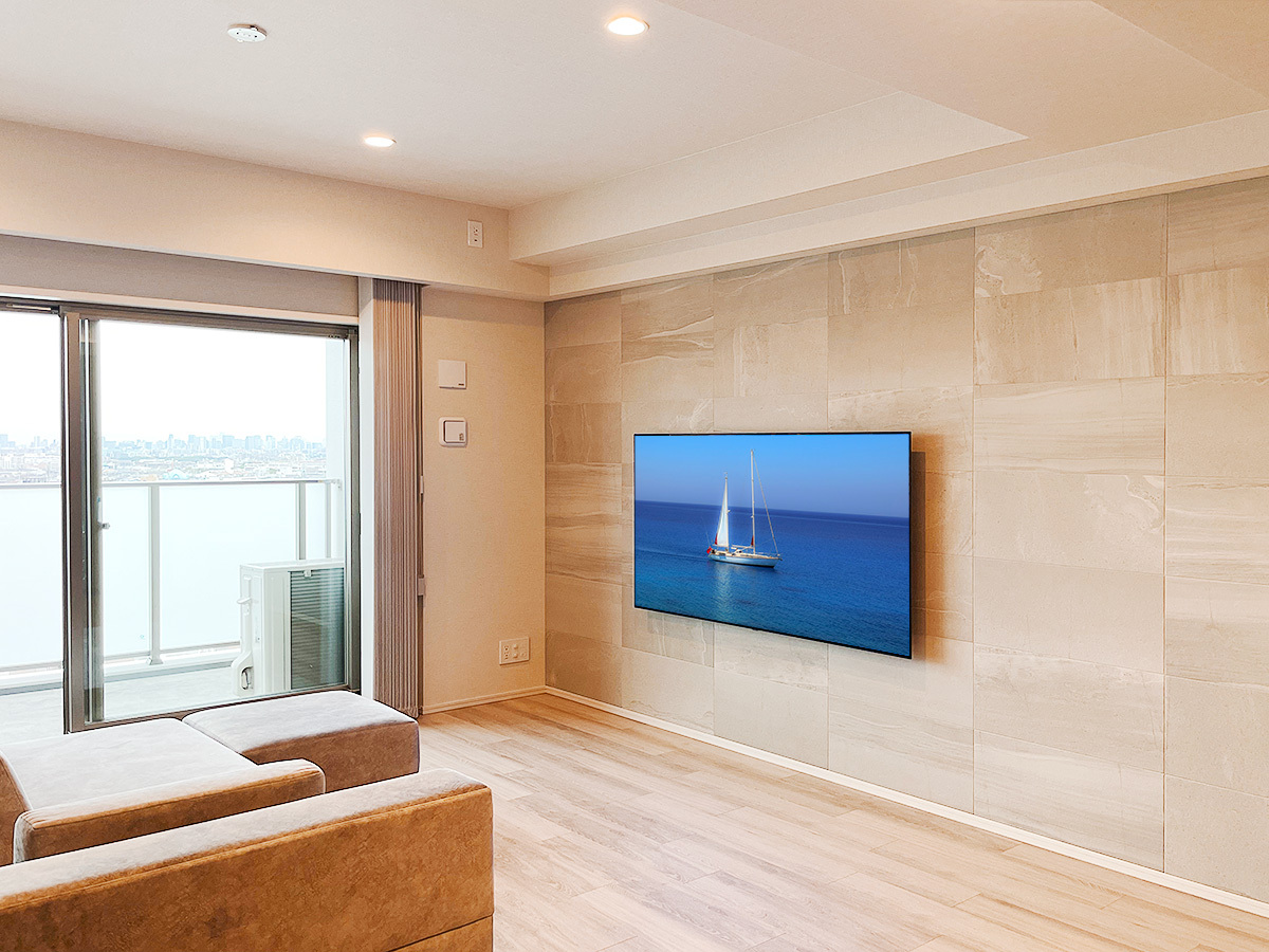大阪府豊中市のマンションでエコカラット(ストーングレース)を貼り、LGの65型有機ELテレビ(OLED65CXPJA)を壁掛け